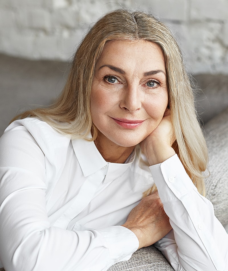Smiling woman with long hair in casual setting