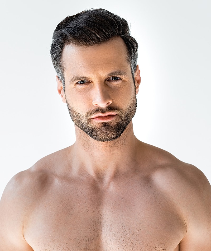 Close-up of a man with a groomed beard.