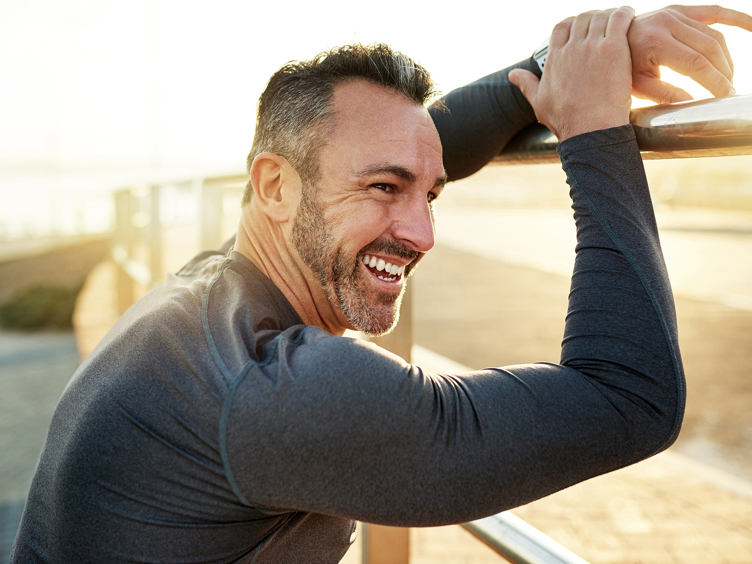 Smiling woman in hat taking a selfie.